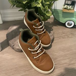 Carter’s size 12M brown color. Heel detail has dinosaur or reptile spikes/scales